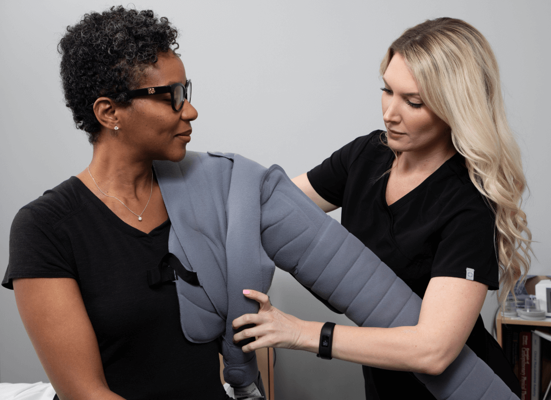 Flexitouch Plus Lymphedema Therapy Patient Receiving Help from Clinician