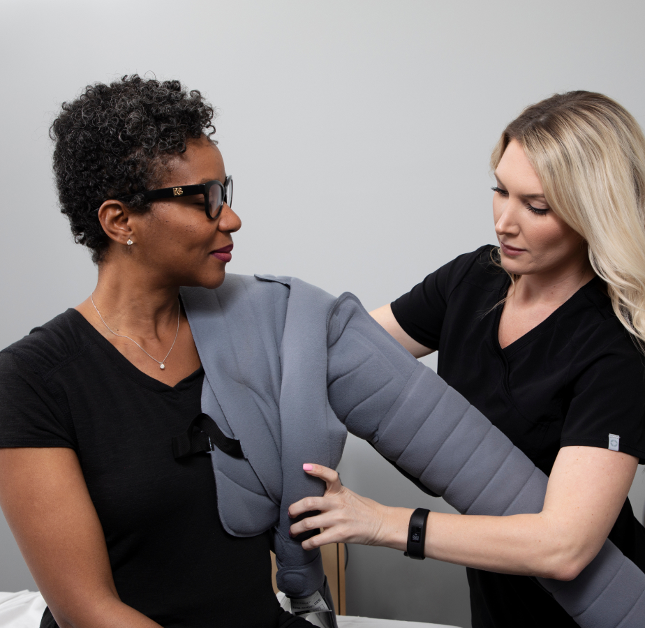 Flexitouch Plus Lymphedema Therapy Patient Receiving Help from Clinician
