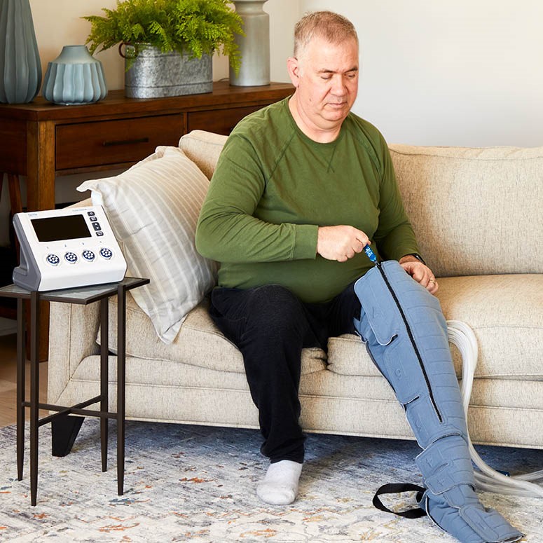 man using his pneumatic compression device